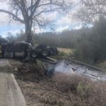 Truck carrying limestone overturns on Chimney Rock Rd.